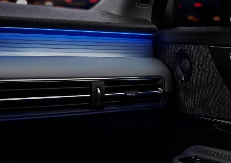 A thin available ambient blue lighting illuminates the pinstripe aluminum under an ebony dashboard, emitting a cool energy | Mark Ficken Lincoln in Charlotte NC