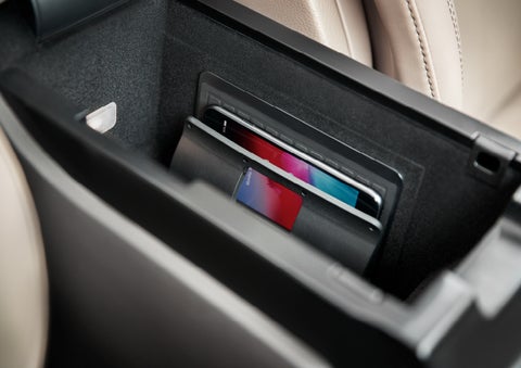 A smartphone device is securely tucked into the available wireless charging pad for an effortless energy boost | Mark Ficken Lincoln in Charlotte NC