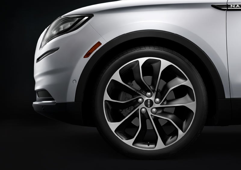 A stylish available wheel is shown on a 2023 Lincoln Nautilus® SUV.