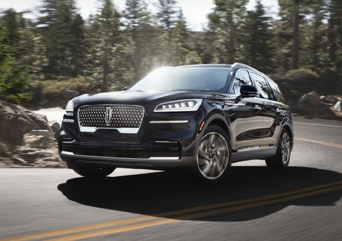 A Lincoln Aviator® SUV is being driven on a winding mountain road | Mark Ficken Lincoln in Charlotte NC