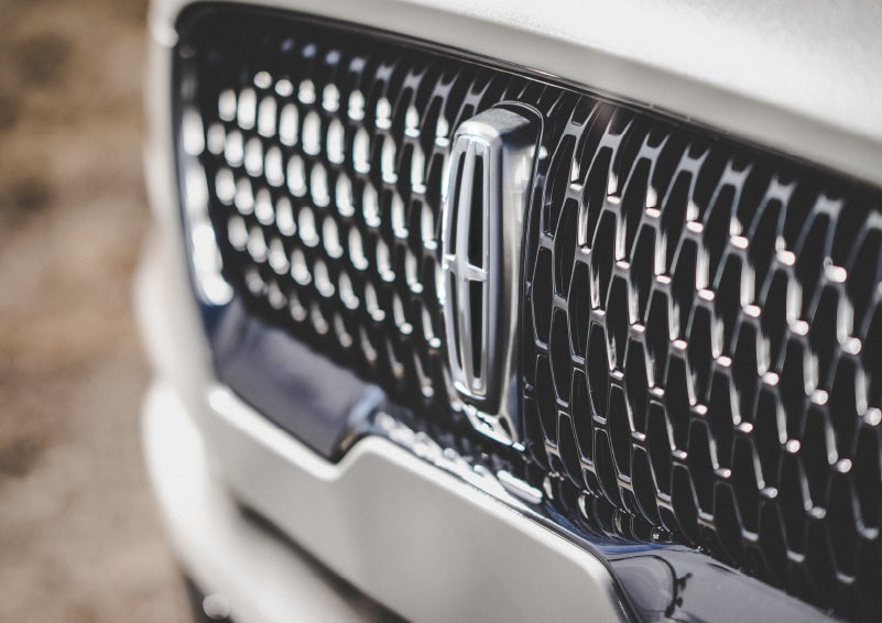 The grille of the 2024 Lincoln Aviator® Reserve model with an eye-catching repeated field of Lincoln Star logo shapes | Mark Ficken Lincoln in Charlotte NC